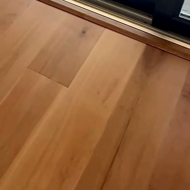 Hardwood floor cut clean at a threshold.